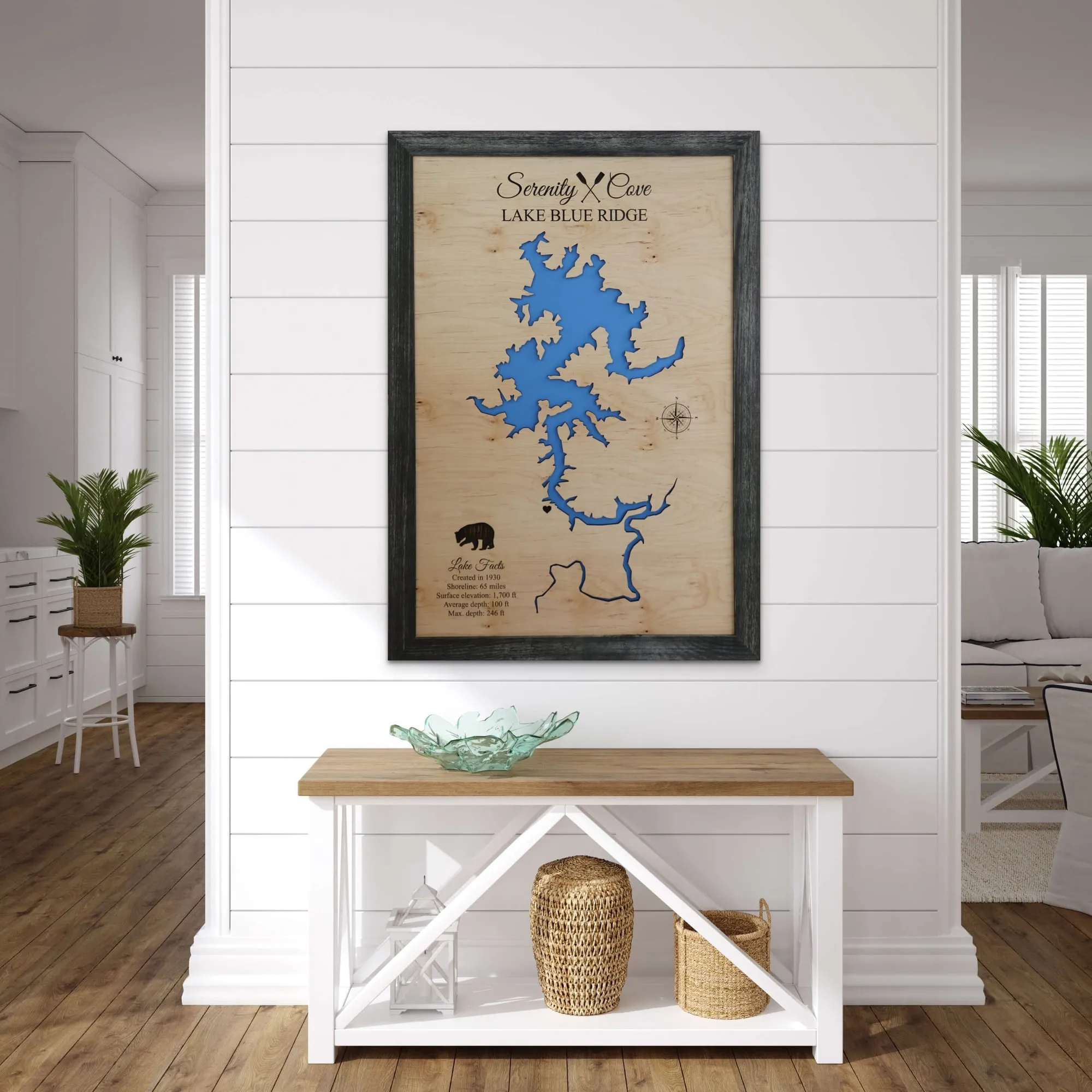 Framed 3D wood lake map on a wall above a bench